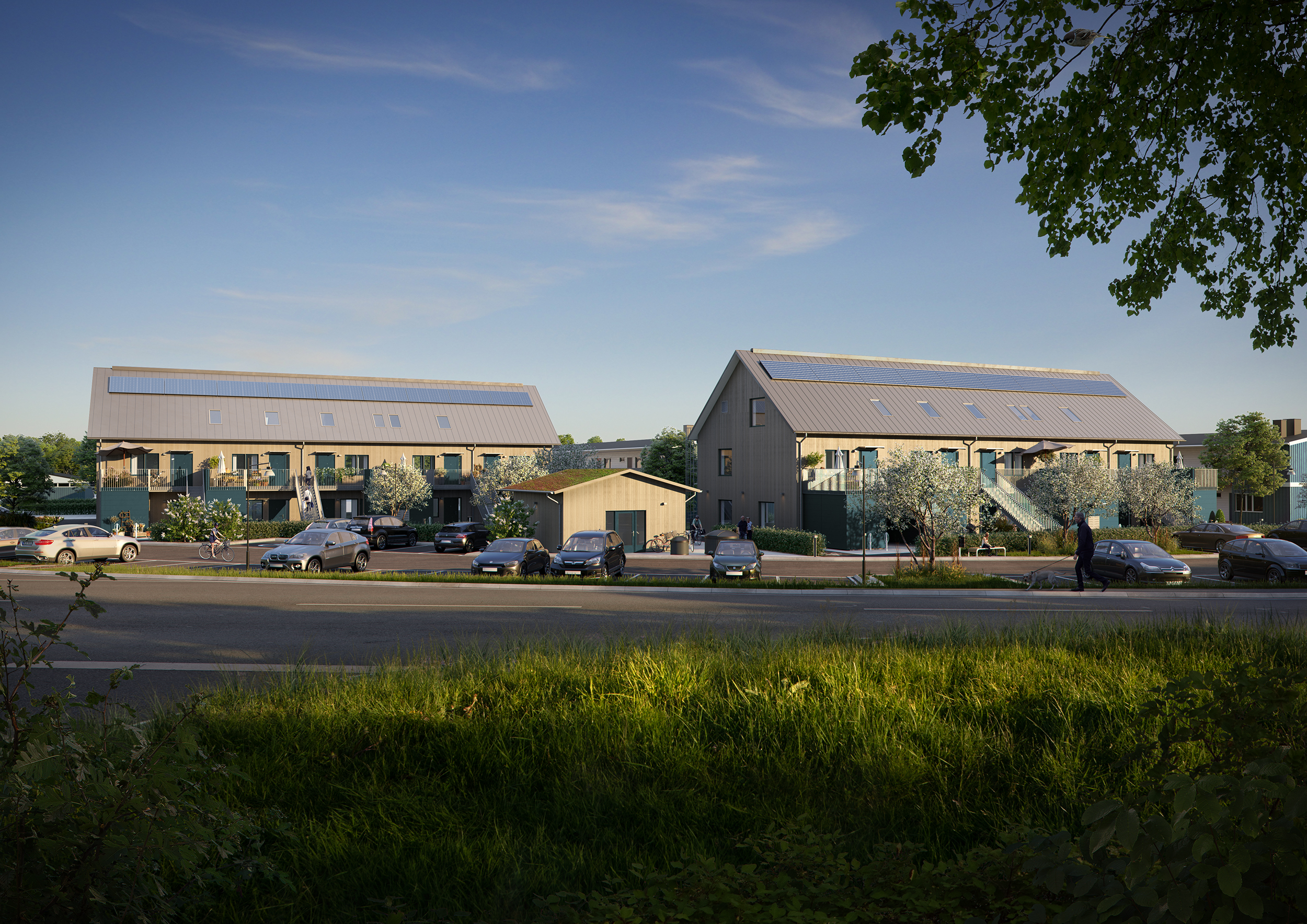 visionsbild över de nya husen på Kullgårdslängan i Lerum, två låga bostadshus i två plan med solceller på taket